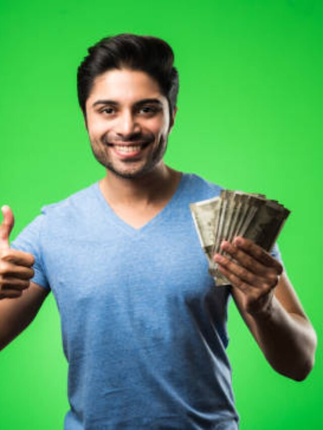 Indian happy man with money fan, standing isolated against green chroma screen